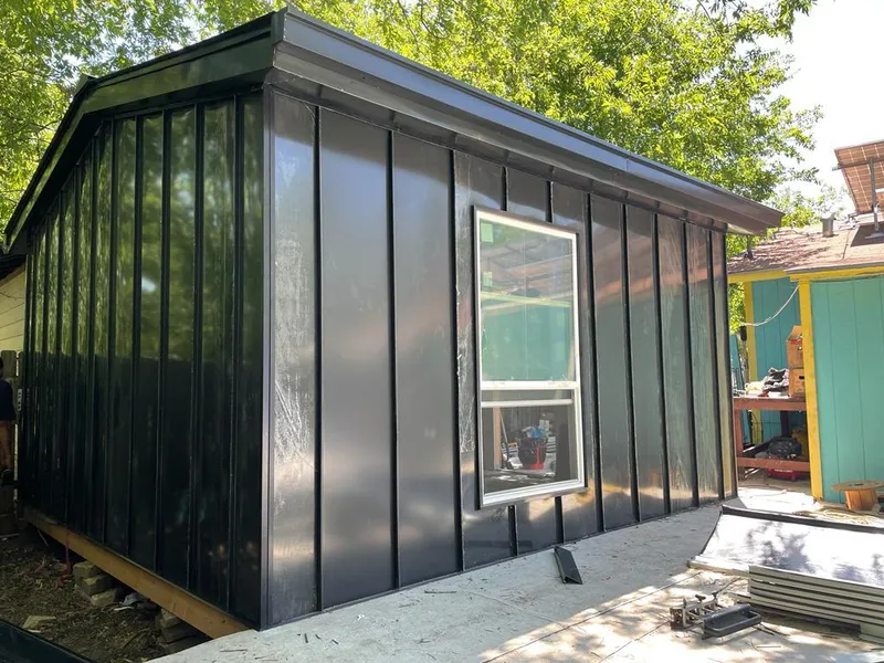 Black standing seam metal wall panels for Roof Inspection in Girard