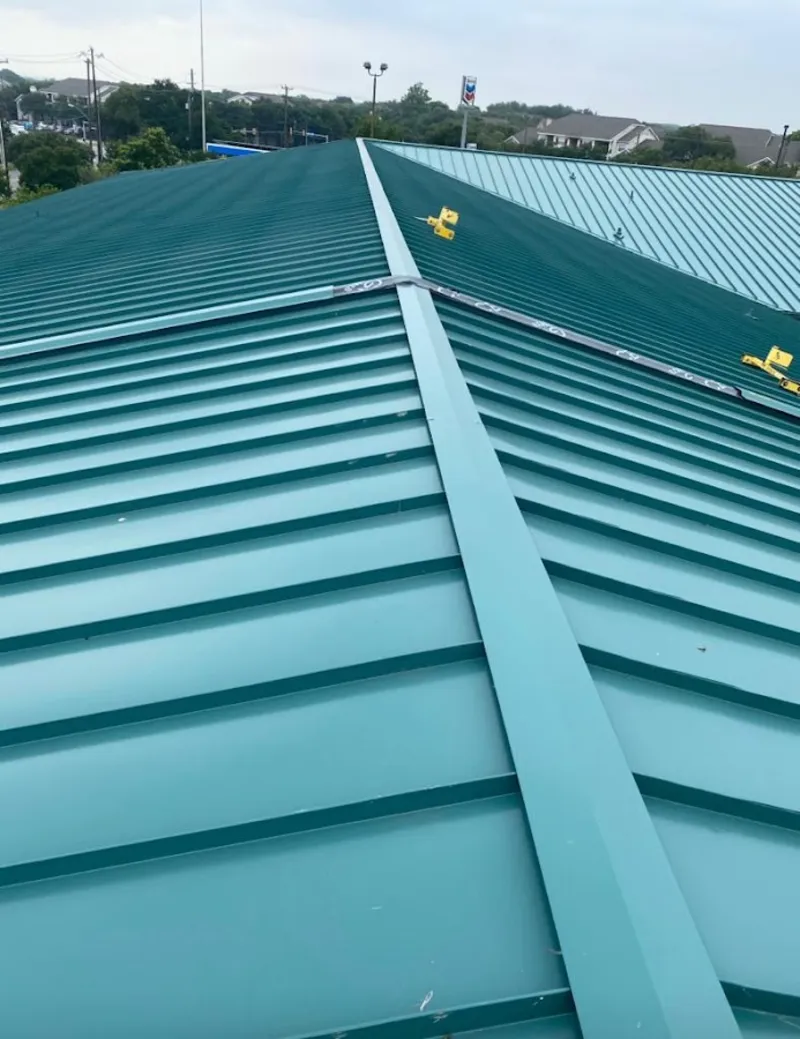 Green commercial metal roof ridge and valley for Metal Roof Repair in Girard